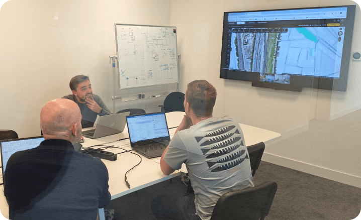 TM Roco team members looking at the propeller software