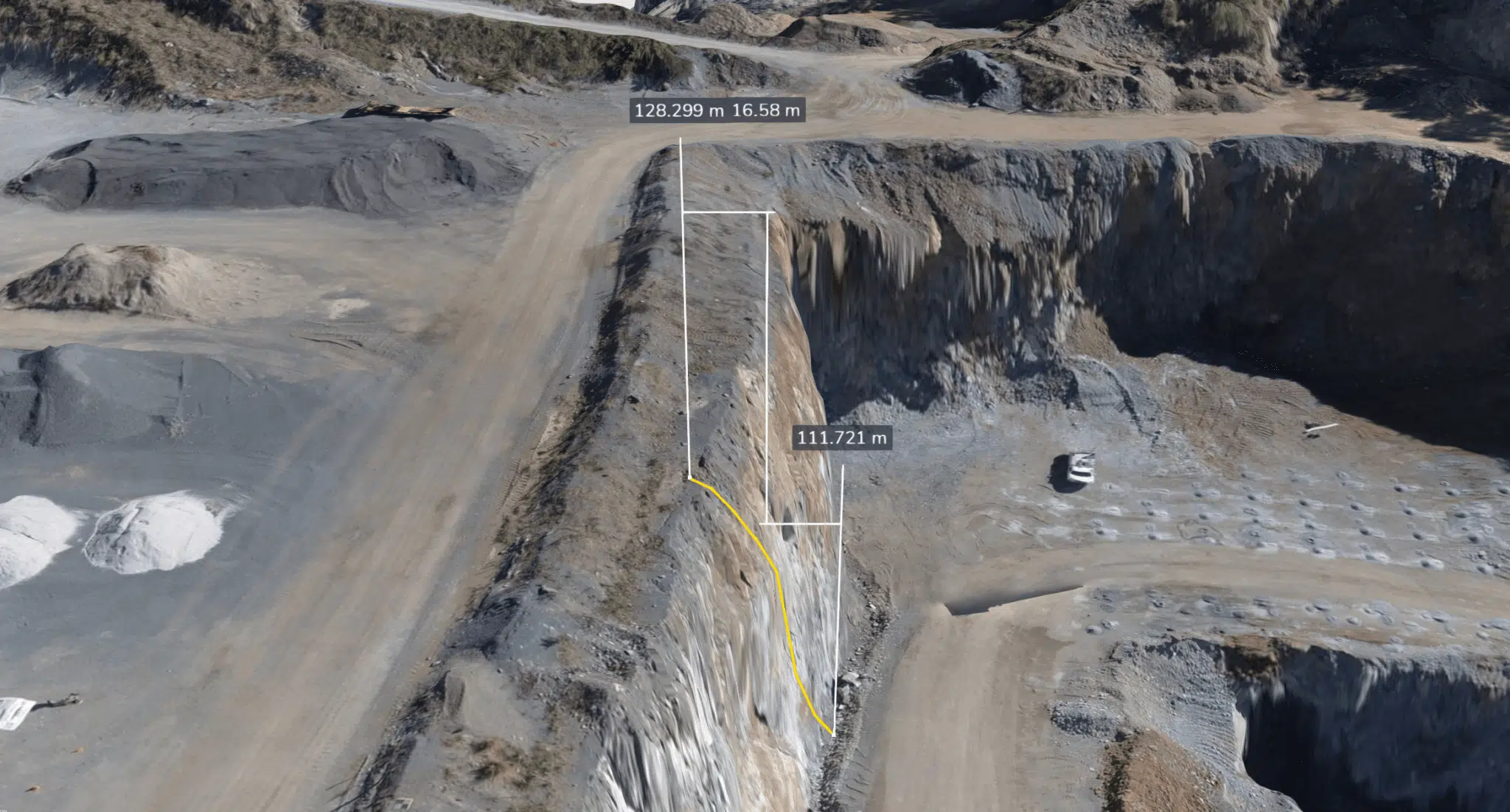 Drone photogrammetry measurements are shown on the top of a mine site.