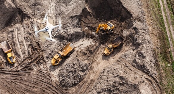 drone photogrammetry capturing aerial images over a construction site