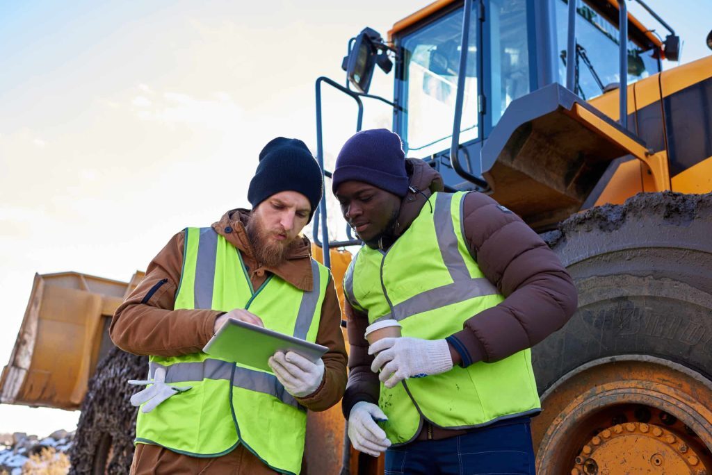 Two people looking at Propeller mobile app on job site