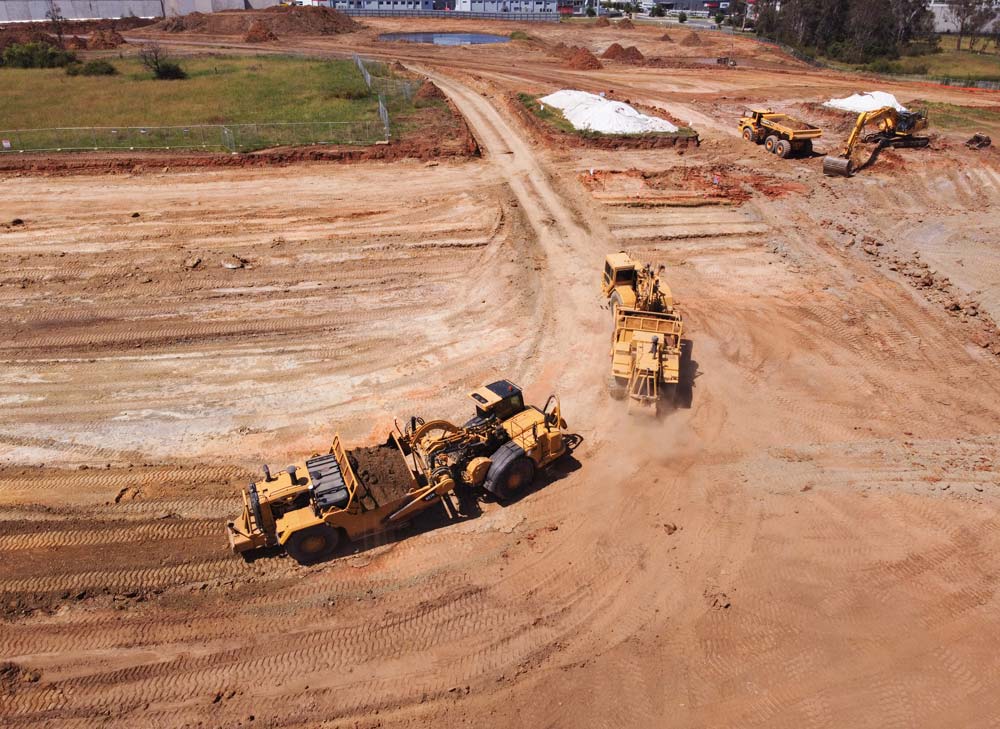 Aerial photo of two earthmovers on site.