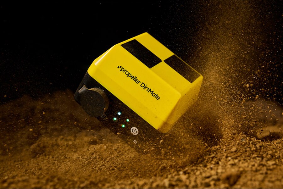 Dirtmate falling into a pile of dirt