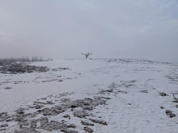 drone flying in winter in low light
