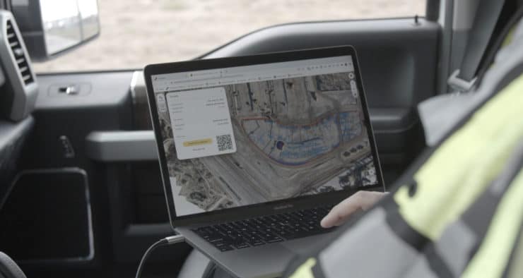 worker looking at propeller platform on screen