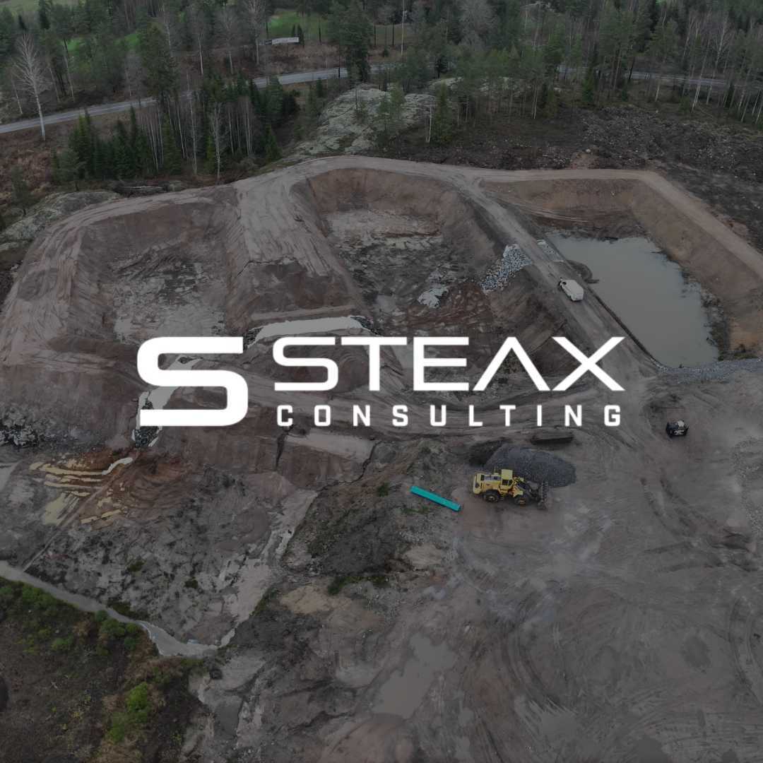 Steax logo in front of a construction site