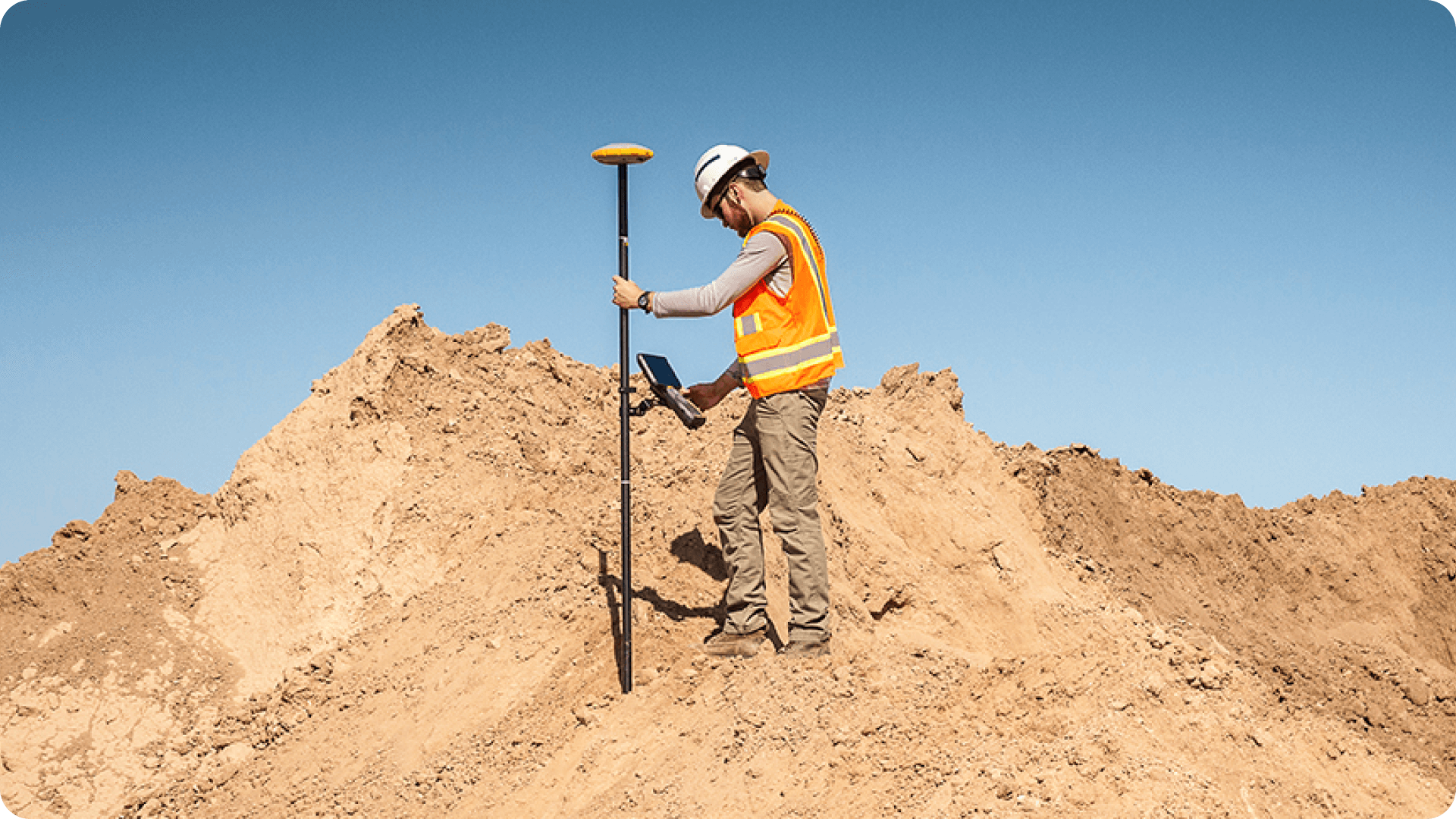 How to integrate drone surveys and rover/total station surveys image of person using GPS rover on a construction site