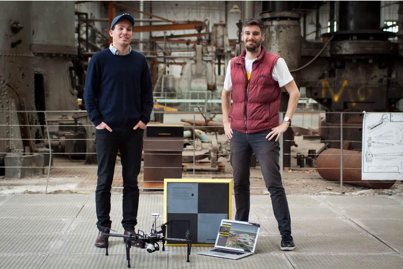 Propeller Aero founders Rory and Francis with a drone at an industrial site.