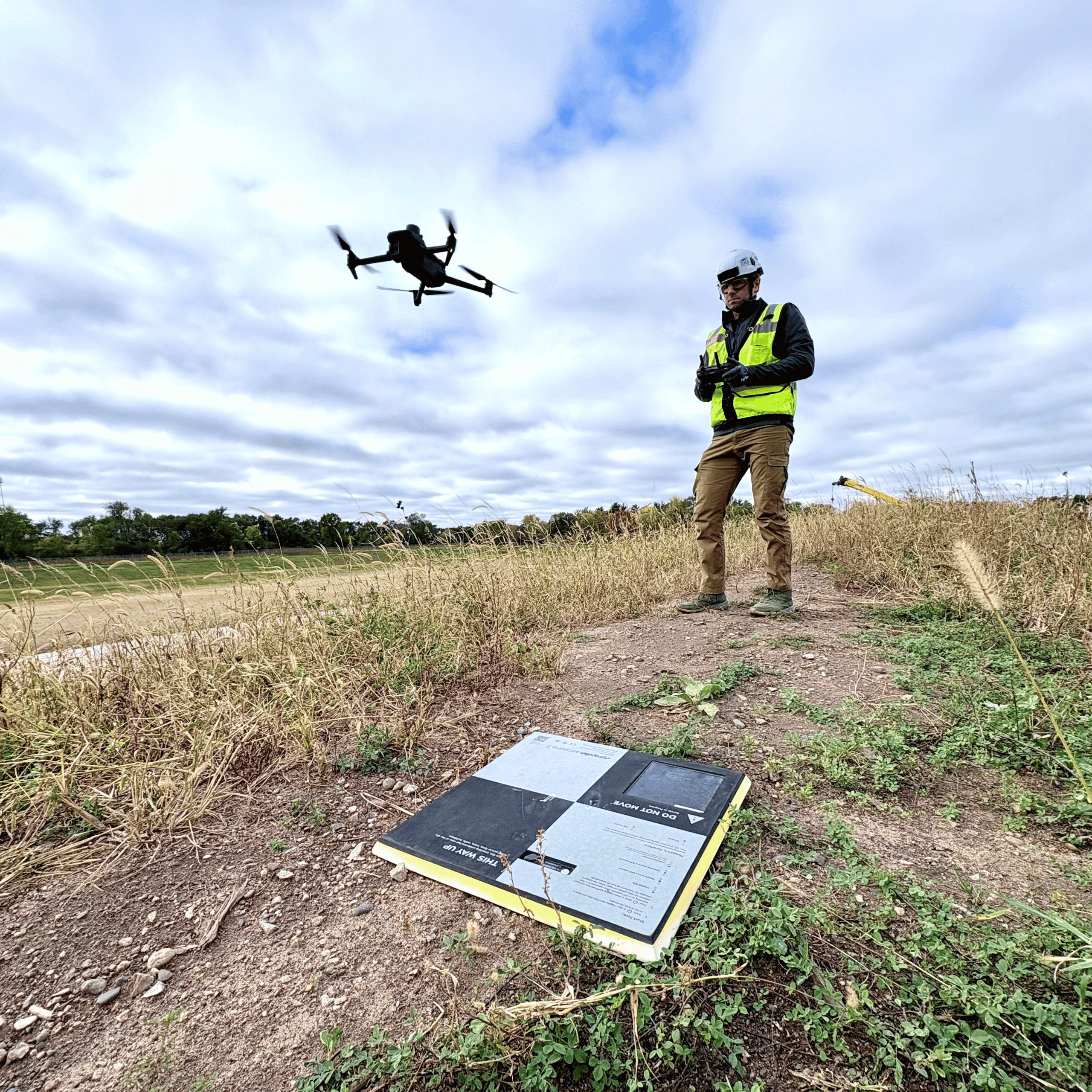 Mortenson Construction flying a drone with an aeropoint in front