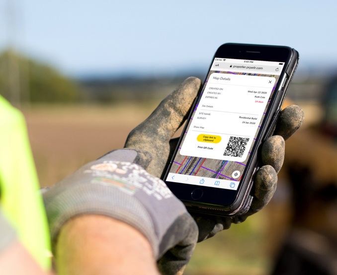 Propeller mobile access link on a smart phone beng used by a construction worker in the field