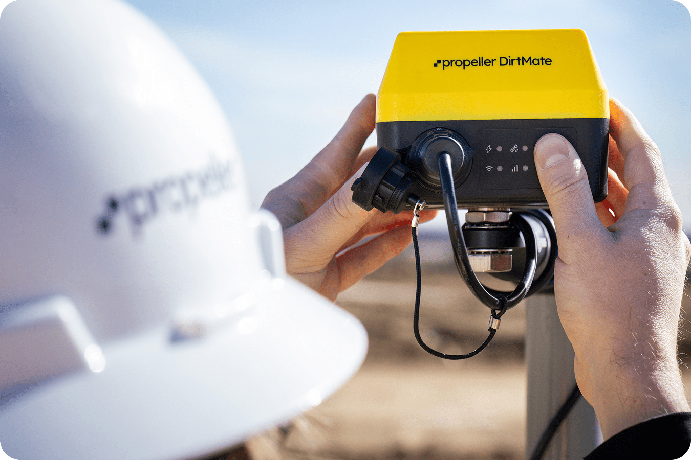 A DirtMate being installed on a pole