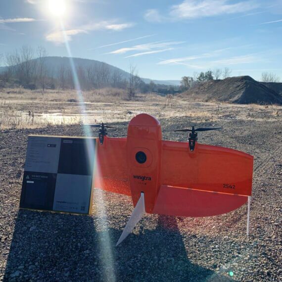 an image of an AeroPoint resting on a Wingtra drone on an aggregates site