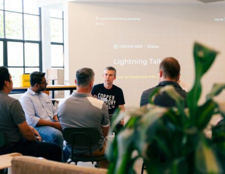 Propeller team members speaking at a conference