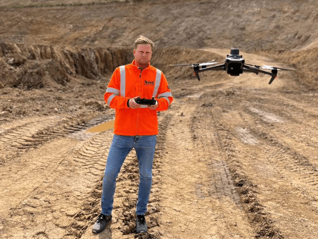 trippe employee flying a drone