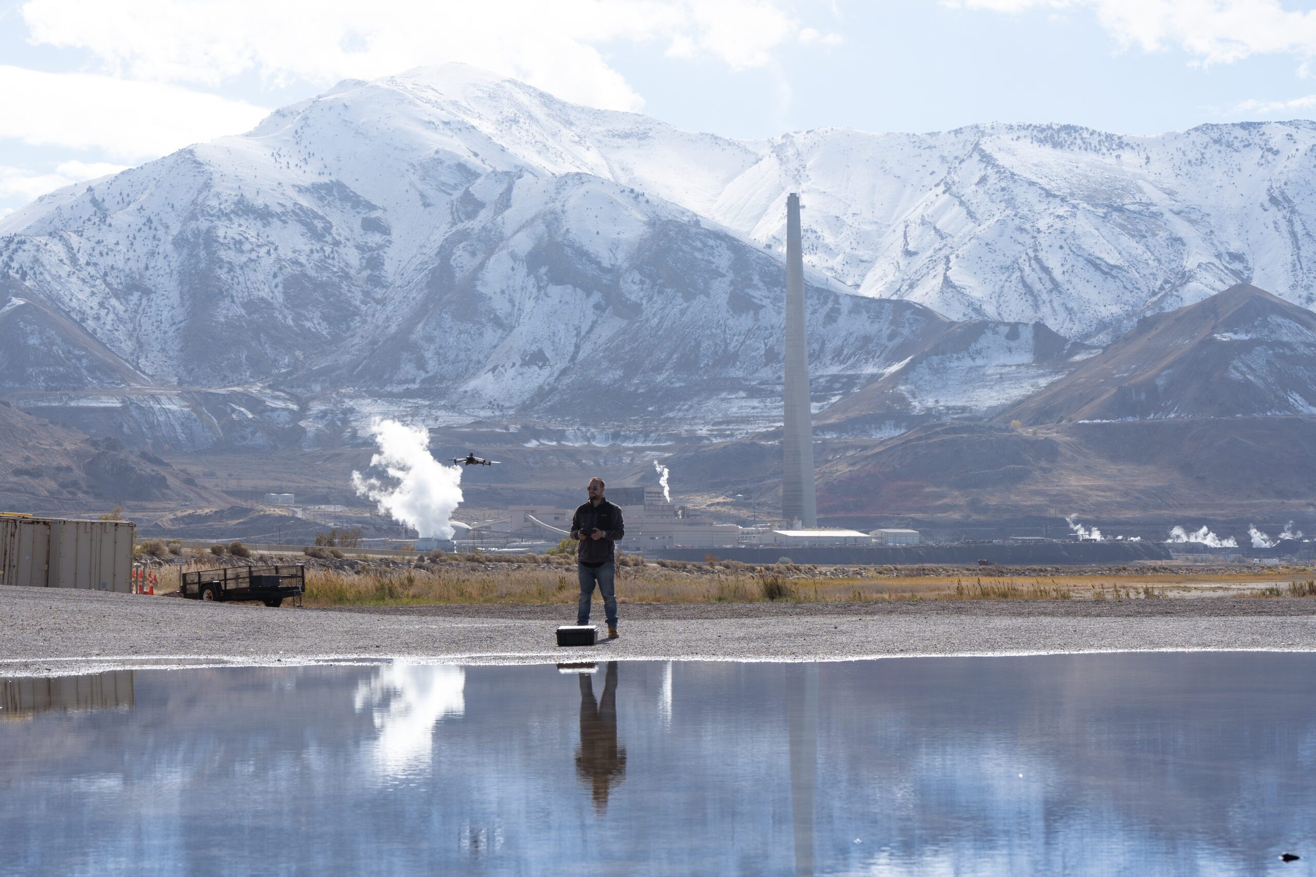 man flying M3E on surveying site to capture ground for survey mapping