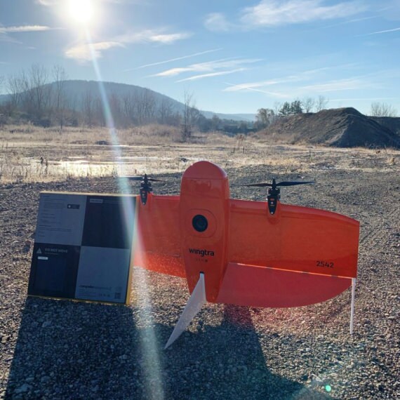 an image of an AeroPoint resting on a Wingtra drone on an aggregates site