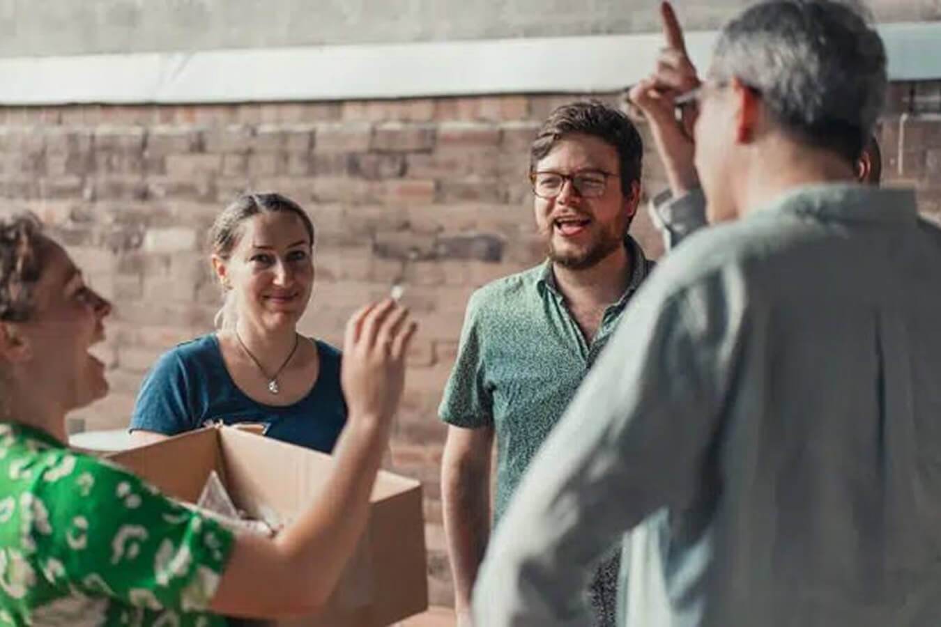 Propeller team members collaborating in person.