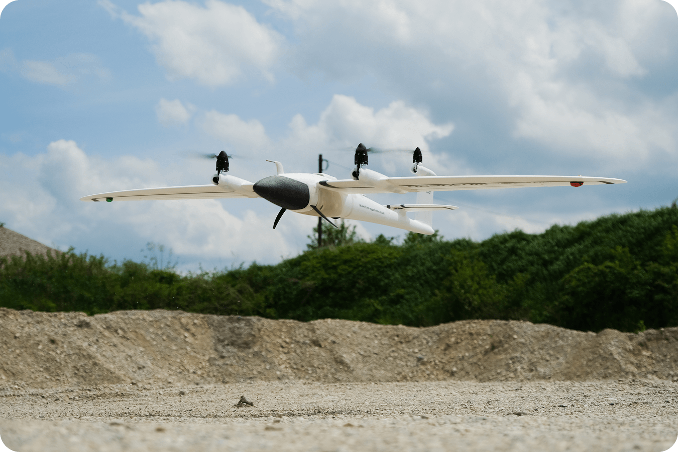Quantum trinity drone flying over construction site