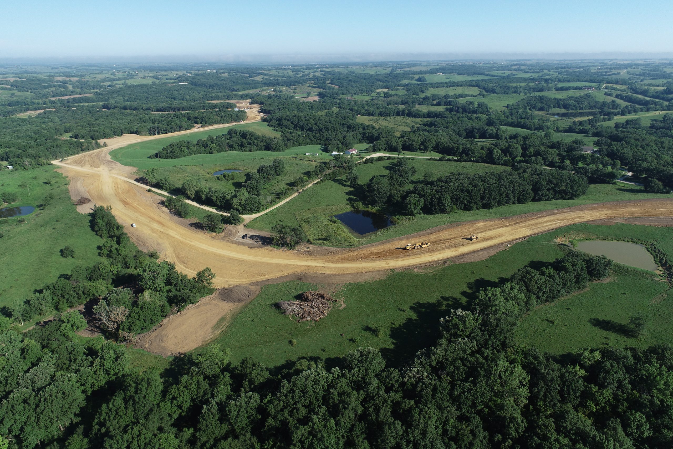A drone photo of R&K excavation worksite most notably highlighting a haul road and dig area
