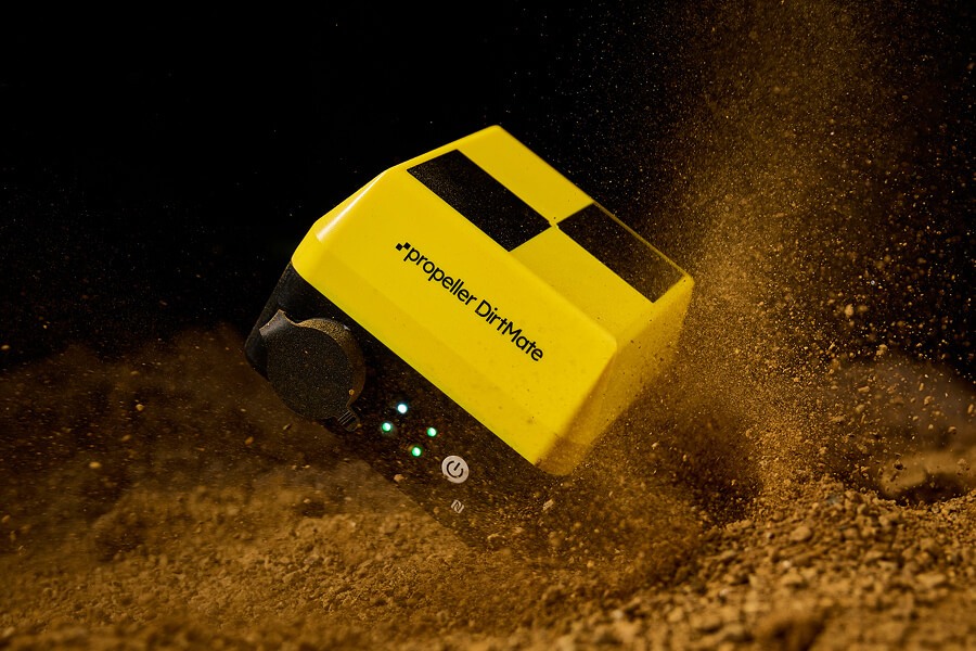 DirtMate falling into a pile of dirt