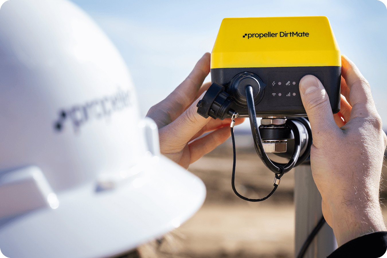 A DirtMate being installed on a pole